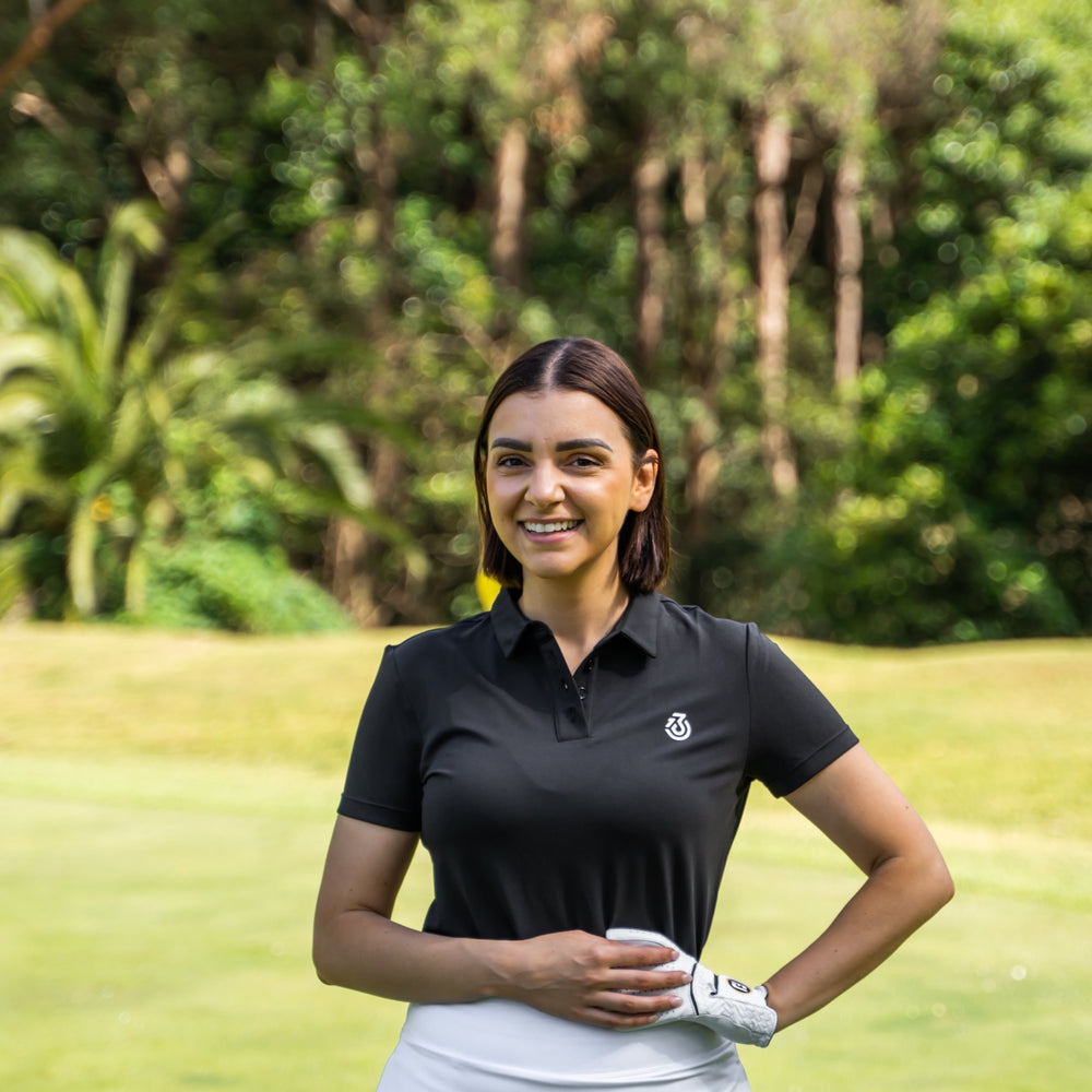 Golf girl wearing black polo